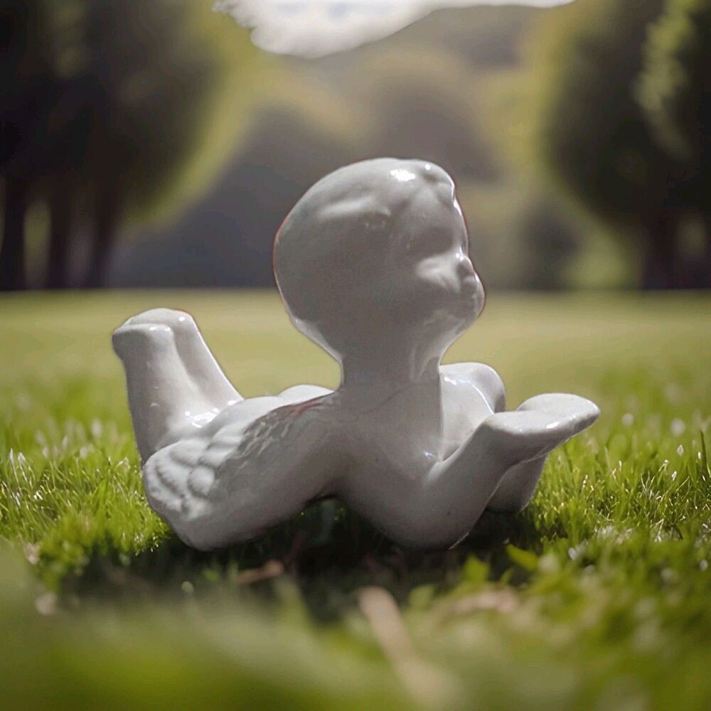 Vintage Glossy White Porcelain Laying Cherub Angel Figurine Shelf Sitter Decor